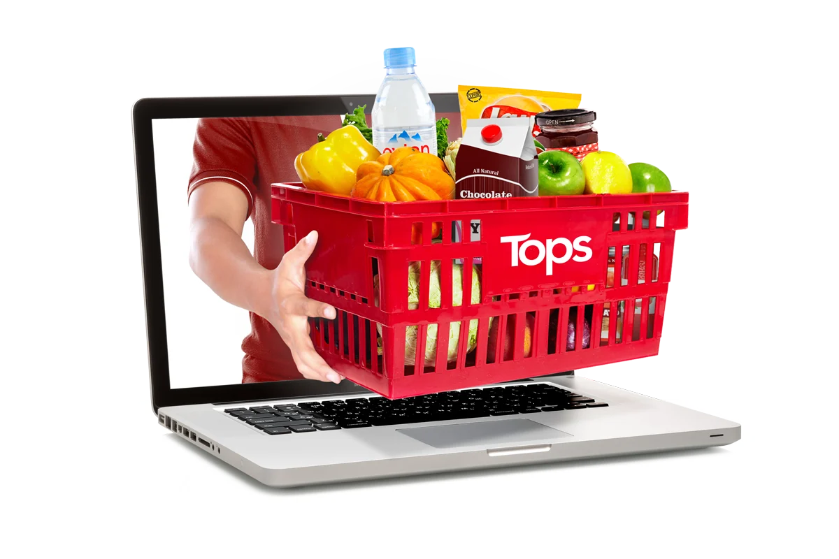 A Tops basket full of groceries, coming out of a laptop screen.